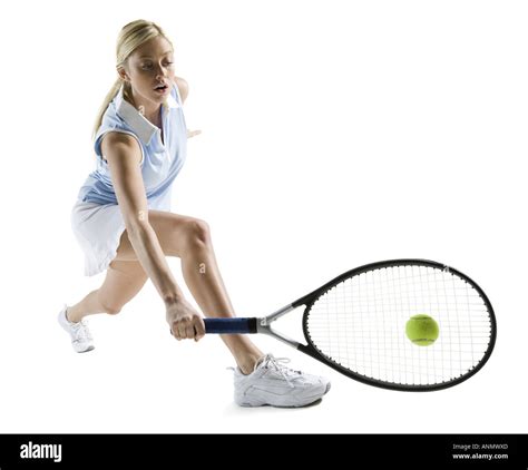 Young Woman Hitting A Tennis Ball Stock Photo Alamy