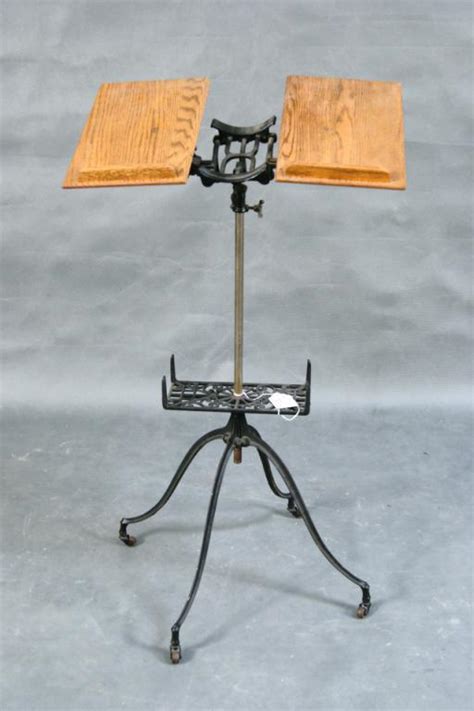Cast iron adjustable book stand with oak book holders. Antique cast iron Dictionary stand w dictionary