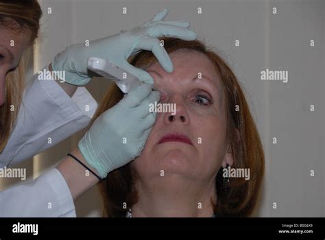 A Woman Receives An Eye Examination Stock Photo Alamy
