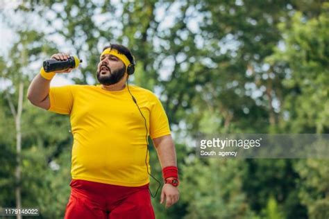 Overweight Man Drinking Water Photos And Premium High Res Pictures