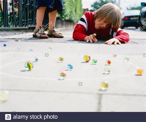 Boys Playing Marbles High Resolution Stock Photography And Images Alamy