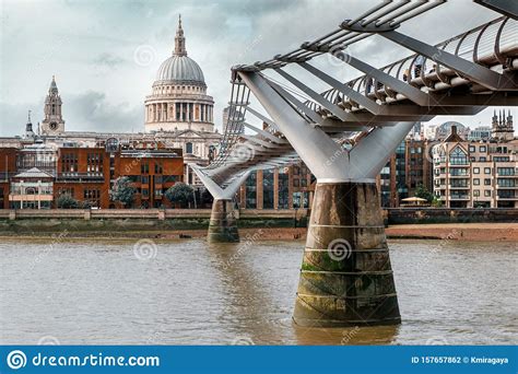 The Millenium Bridge And Saint Paul Cathedral In London Editorial