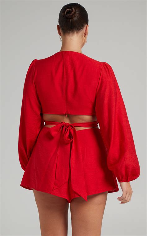 Primrose Cut Out Tie Back Long Sleeve Playsuit In Red Showpo Eu