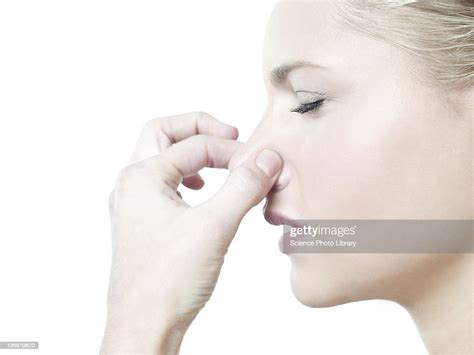Woman Holding Her Nose High Res Stock Photo Getty Images