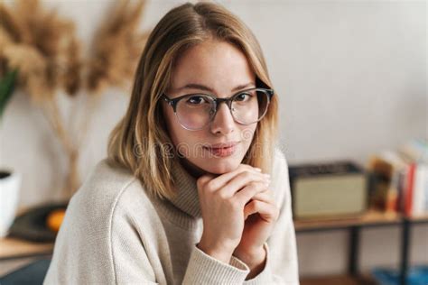Photo Of Nice Attractive Woman In Eyeglasses Looking At Camera Stock