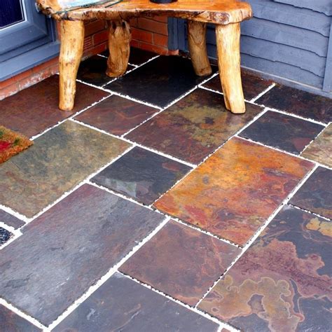 Use a soft scrub brush to clear away all dust and debris from the floor. This multicoloured slate tile can be used both indoors and outdoors to create beautiful tiled ...