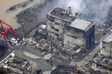 rescuers race against time in search for survivors in japan after powerful quakes leave 73 dead