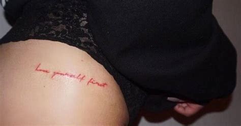 You might choose to get this tattoo in a place where nobody can see it when you are dressed. Red ink "love yourself first"