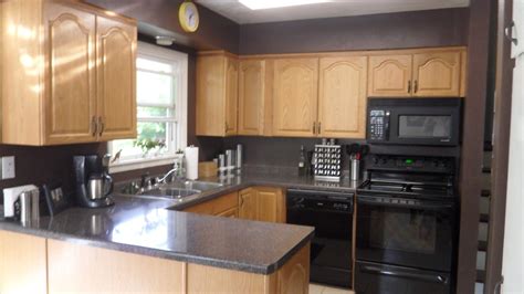 You can paint the oak cabinets and the laminate ends, provided you do the prep work necessary for a good finish. Image result for kitchen with oak cabinets with black ...