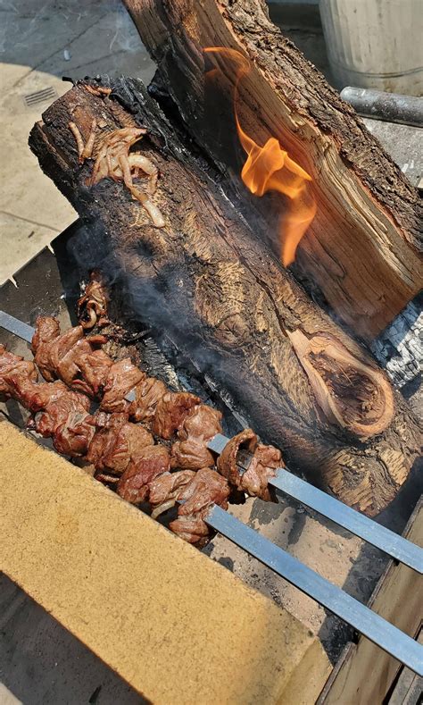 Classic Armenian Bbqd Steak Against Fire Logs Pics