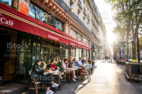 People Relaxing Eating And Drinking In Restaurant In Paris France Stock