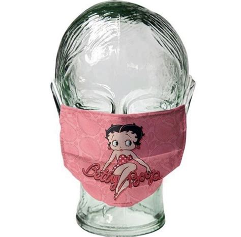 a glass head with a pink bandana on it