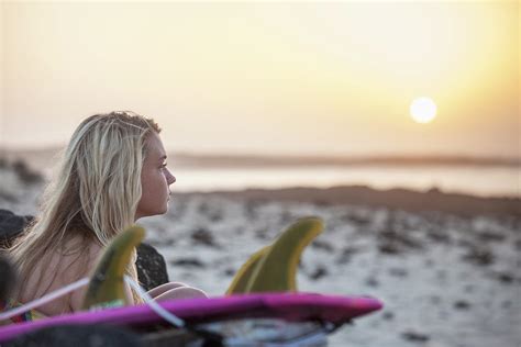 Blonde Surfer Girl Sitting On The Beach Photograph By Mauro Ladu Fine