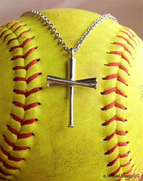Baseball jewelry for men and women is perfect for on the field, off the field, and the biggest fans! View Softball Bat Cross Necklace Images