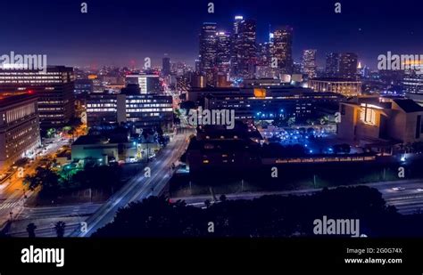 Cinematic Aerial View Of Urban Downtown Streets And City Skyline At