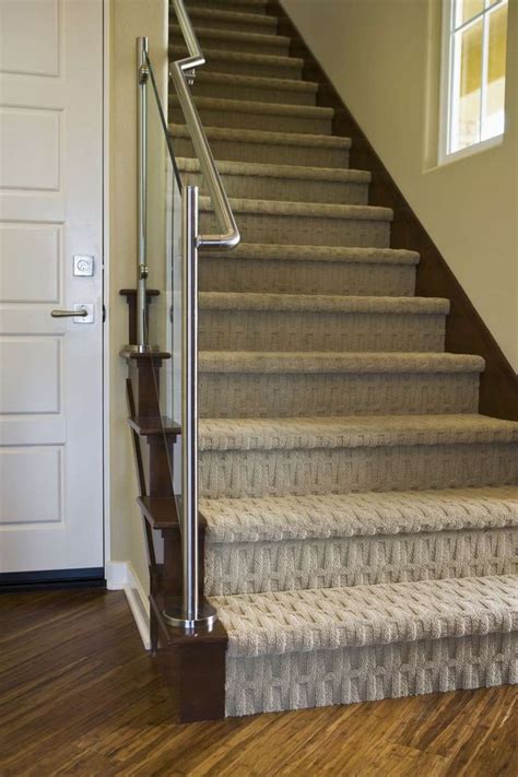 A Staircase With Carpeted Steps Leading Up To The Door