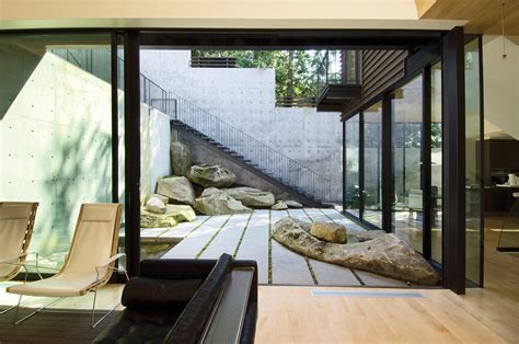 Showcase Courtyard House On A Steep Site Features