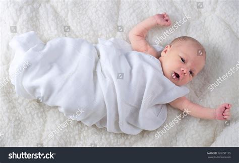 Newborn Baby Boy Wrapped In White Blanket Stock Photo 126791195