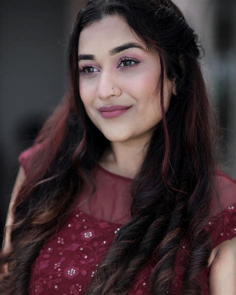 actress parvathy krishna looking gorgeous in red gown new photoshoot goes viral ആരിത് ദേവതയോ