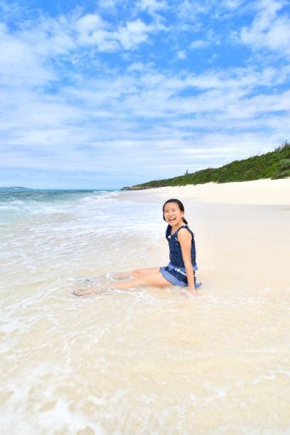 Japanese Girl Sitting At The Beach Stock Photos Pictures And Royalty