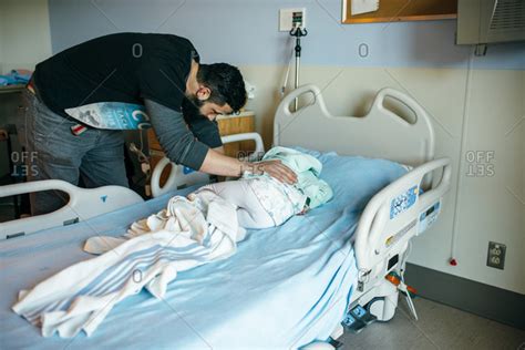 Father Comforting Sick Child In A Hospital Bed Stock Photo Offset