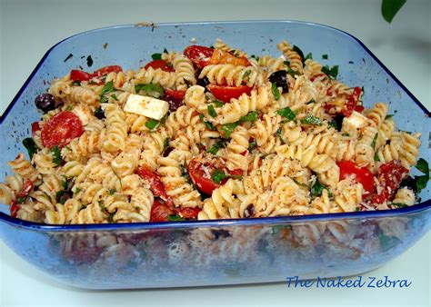 To reduce the sharpness of the onion, soak the sliced onion in ice cold water for 30 minutes and pat with paper towels to dry, before adding to salad. The Naked Zebra: Tomato Feta Pasta Salad- Ina Garten