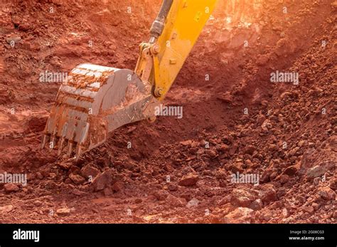 Backhoe Working By Digging Soil At Construction Site Bucket Of Backhoe