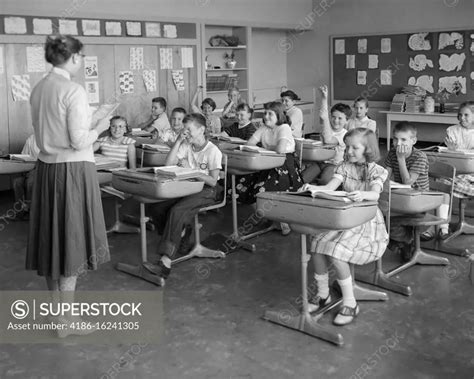 1950s 19560s Classroom Elementary Grade School Teacher Back To Camera