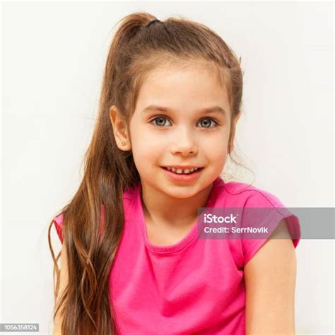 Portrait Of Smiling Brunette Seven Years Old Girl Stock Photo