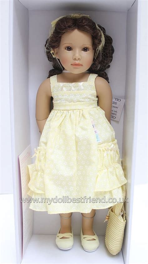 A Doll In A Box With Shoes And A Purse