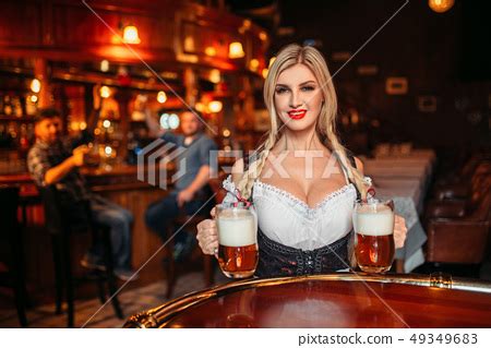 Sexy Waitress With Large Breasts In Pub Stock Photo Pixta