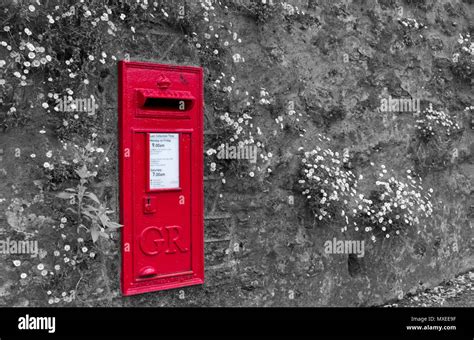 Red Post Box In Stone Wall England Uk Stock Photo Alamy