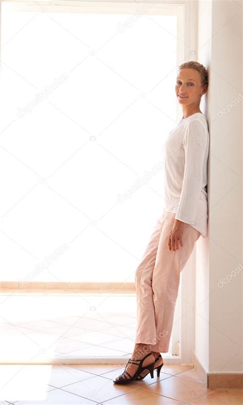 Wall Side View Woman Leaning Against Wall Redheaded Beautiful Woman Leaning Against A Wall