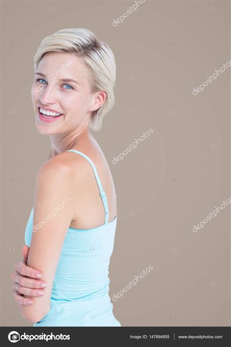 Woman Arms Folded Looking Over Shoulder Stock Photo By ©wavebreakmedia