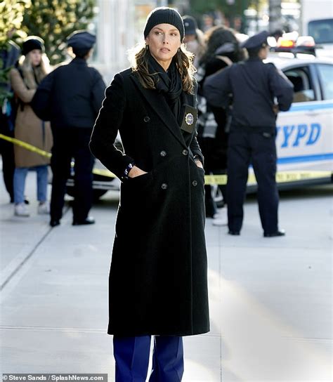 Bridget Moynahan Seen In A Long Black Overcoat With Matching Beanie And