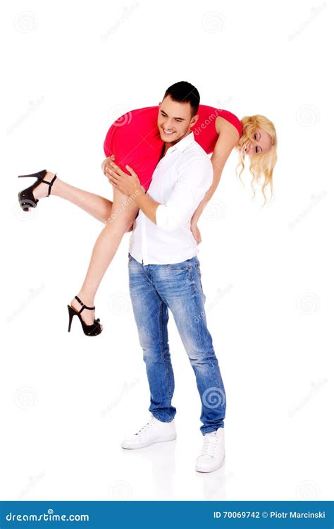 Young Man Carrying His Girlfriend On The Shoulder Stock Photo Image