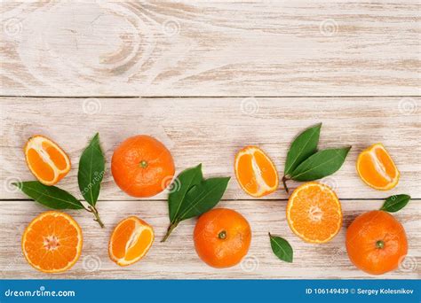 Orange Or Tangerine With Leaves On White Wooden Background Flat Lay