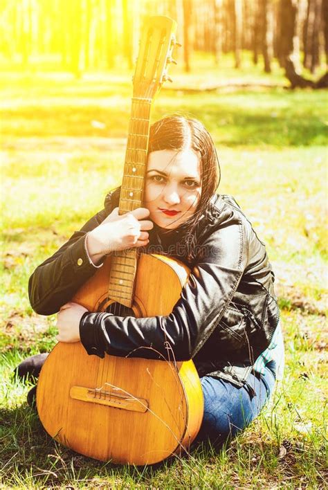 Beautiful Woman Playing An Acoustic Guitar Outdoor Stock Photo Image