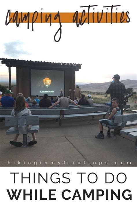 People Sitting On Benches In Front Of A Movie Screen With The Words Camping Activities Things To