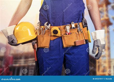 Construction Worker With Tool Belt At Building Site Stock Image Image