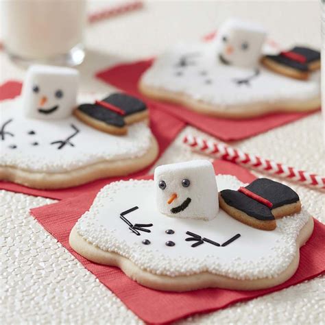 Then, bust out the sprinkles and icing and follow one of these holiday dessert decorating ideas. Melting Snowman Cut-Out Cookies | Wilton