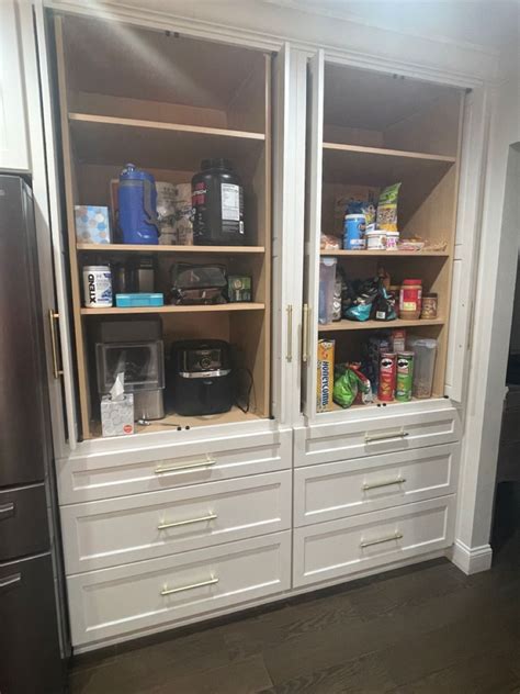 Kitchen Renovation Musts Retractable Doors Open Up To Appliance Pantry