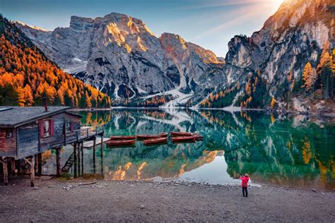 Tourist Takes Photo Of Braies Pragser Wildsee Lake With Boats And