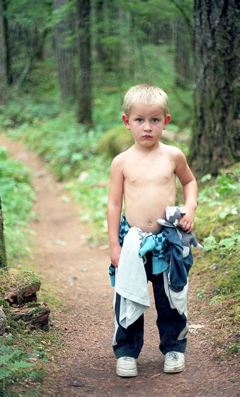 Shirtless Babe Holding Stuffed Wolf Stands On Trail In The Woods By Stocksy Contributor