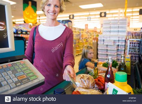 Here you can find many incredible benefits and promotions serve only for our valuable. Girl 7 9 placing items on checkout conveyor belt in supermarket Stock Photo: 11874064 - Alamy