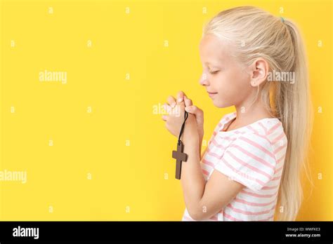 Little Girl Praying On Color Background Stock Photo Alamy