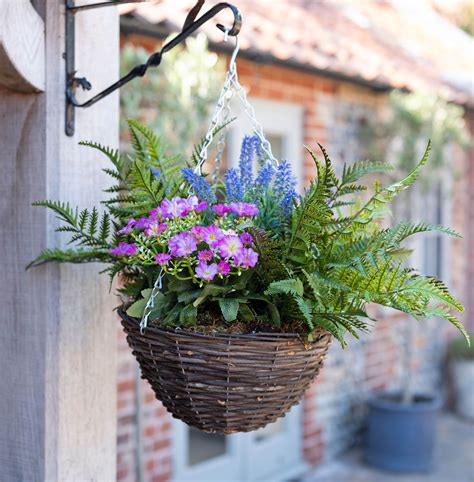 Perhaps you need a floral arrangement that you can use in a spot where live plants are hard to grow. Artificial Wild Flower Hanging Basket | Blooming Artificial