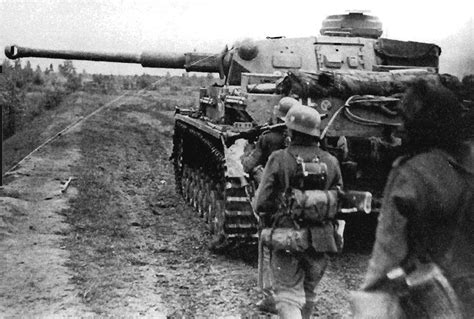 A Panzer IV Ausf F2 Of The 12 Panzer Division Moves Along A Road Near