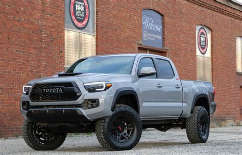 An entune touchscreen infotainment system comes standard with some models, providing navigation, weather details, sports information and multimedia support. 2018 Toyota Tacoma TRD Lifted Custom in Cement Grey