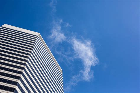 Clean Skyscraper View From Below Against A Blue Sky Free Stock Photo